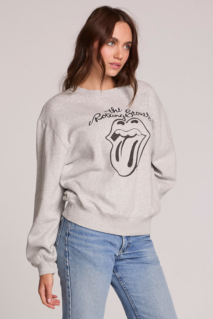 Front view of a woman wearing the Chaser The Rolling Stones Long Sleeve Tee on a neutral background with hand on one hip