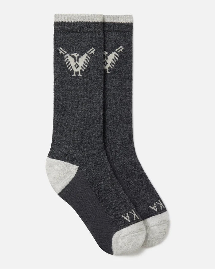 Top-down view of charcoal Condór crew socks with Inca condor motif and contrast gray heel and toe on white background