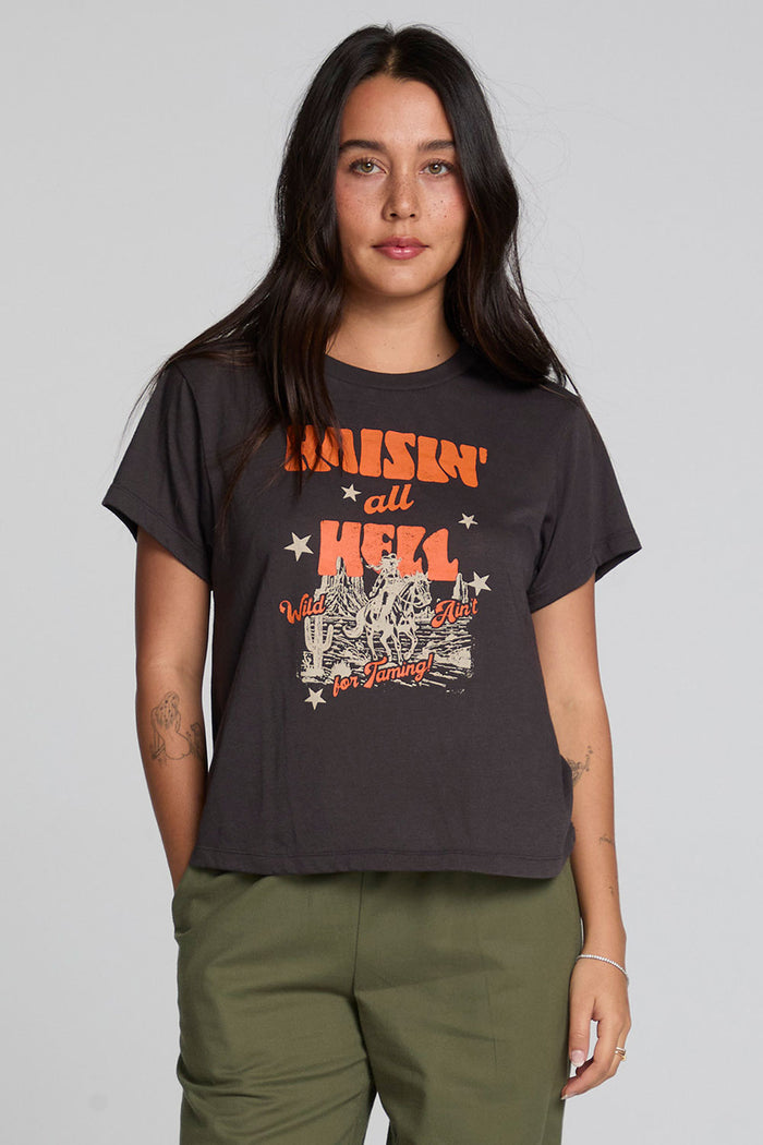 Front view of a woman wearing the Chaser  Wild And Free Cropped Graphic Tee on a neutral background