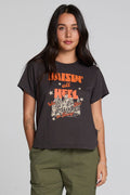 Front view of a woman wearing the Chaser  Wild And Free Cropped Graphic Tee on a neutral background