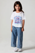 Full body front view of a girl wearing the Chaser Willie Nelson Cowgirl Tee on a neutral background