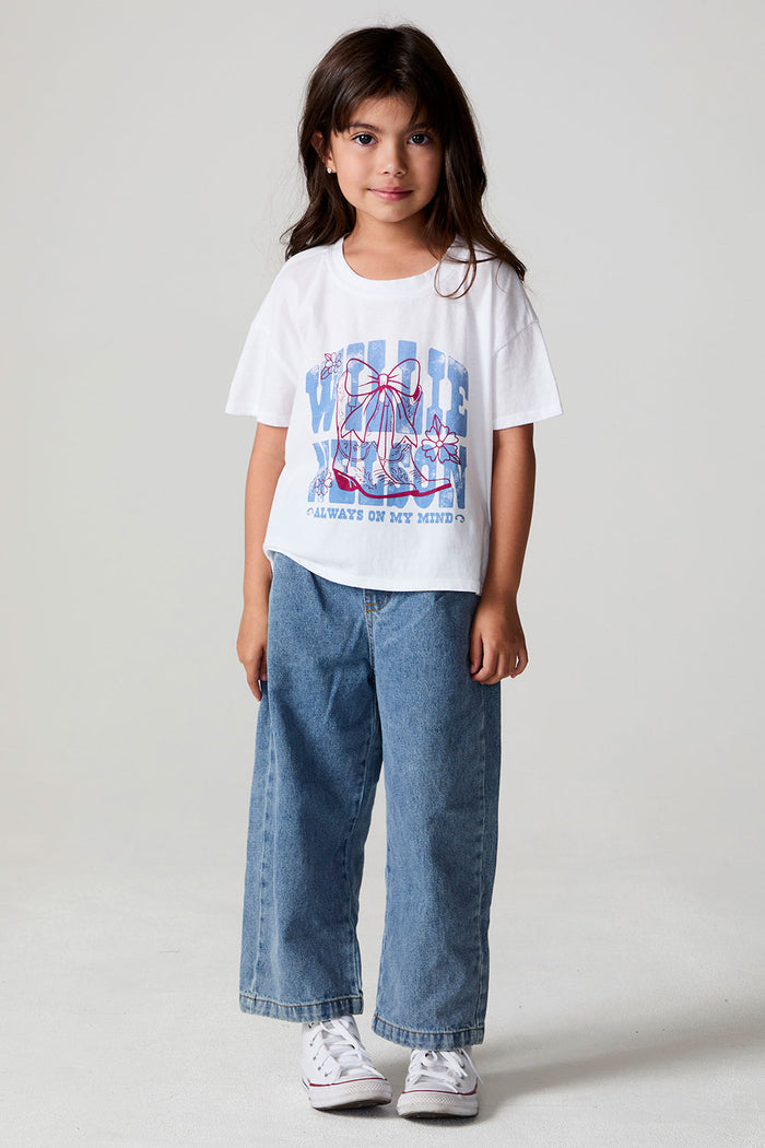 Full body front view of a girl wearing the Chaser Willie Nelson Cowgirl Tee on a neutral background