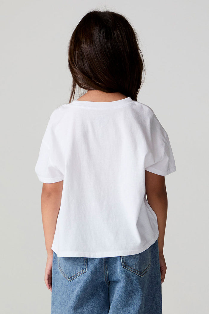Back view of a girl wearing the Chaser Willie Nelson Cowgirl Tee on a neutral background