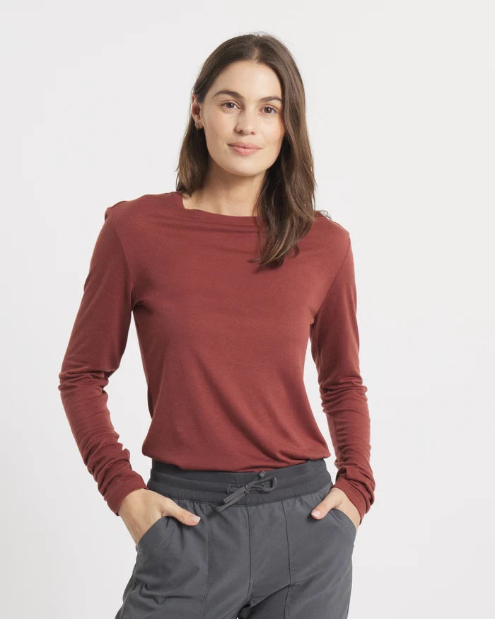 Front view of Women’s Aire Long Sleeve shirt in clay on model, slim fit, lightweight moisture-wicking fabric on plain background