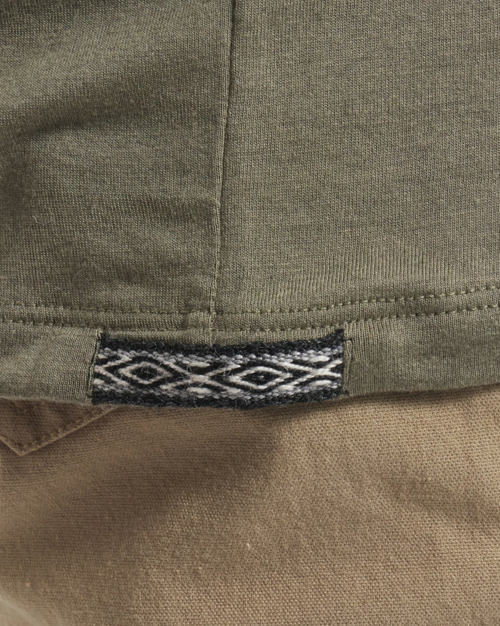 Close-Up of Inca ID on Women's Aire Long Sleeve Hiking Shirt in Eucalyptus / Green – PAKA Apparel