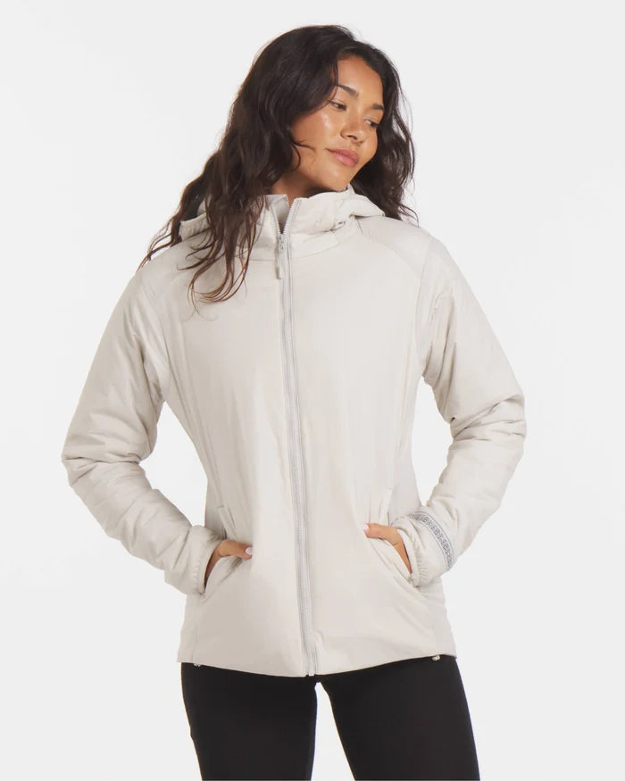 Front view of Women’s Apu Lightweight Puffer jacket showcasing hood, zip front, hand pockets, and lightweight alpaca insulation on white background