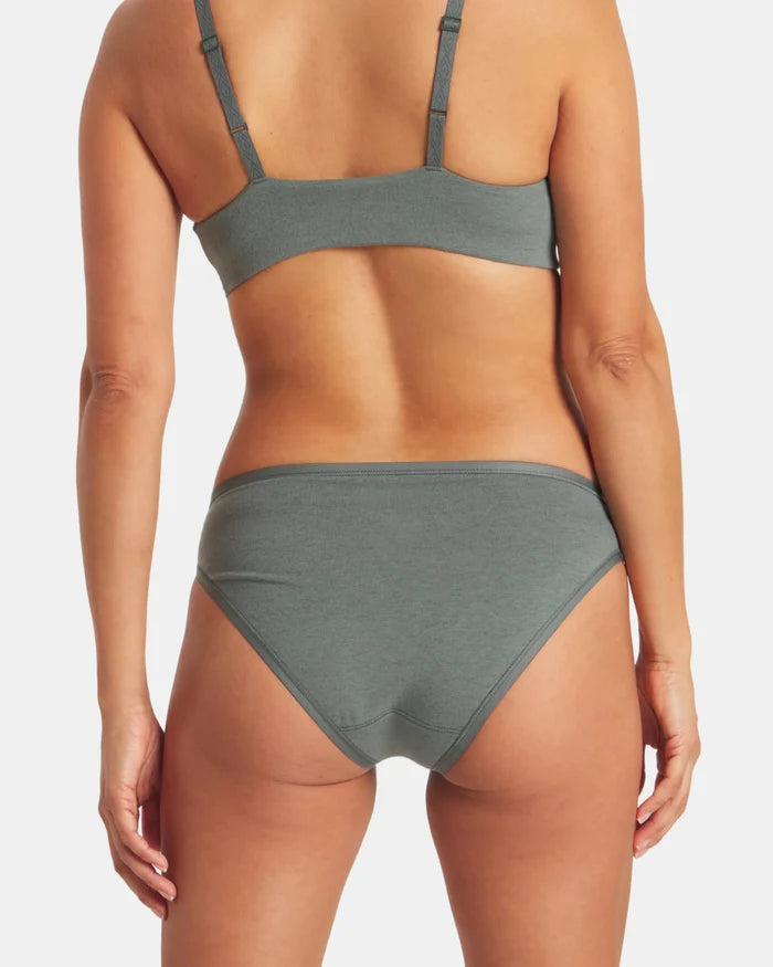 Back view of Women’s Essential Bikini Brief in balsam green on model, showing moderate coverage and elastic waistband on white background