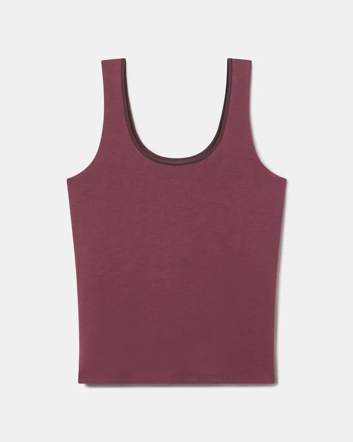 Flat lay of Women’s Essential Tank in raisin showing built-in shelf bra and scoop neck on light gray background