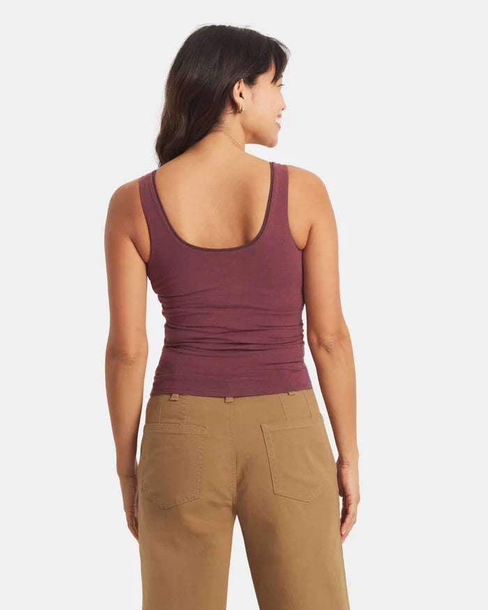 Back view of Women’s Essential Tank, cropped fitted silhouette with wide straps and built-in shelf bra in raisin on gray