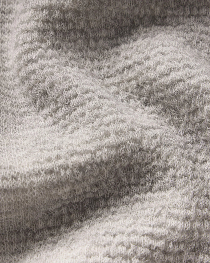 Close-up of a textured Women's Mountain Crew Sweater in Light Grey