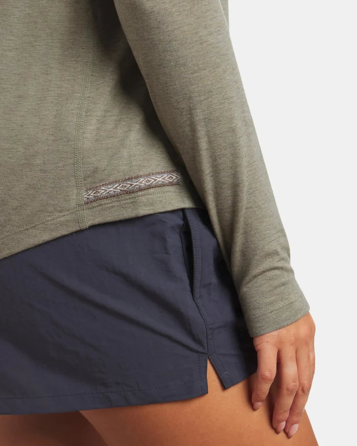 Side close-up of Women’s Sol Crew long sleeve sun shirt in elm showing patterned side hem and slim fit on model