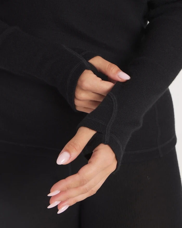Close-Up of Hands Through Thumbholes on Women's Black Thermal Crewneck Top for Winter – PAKA Apparel