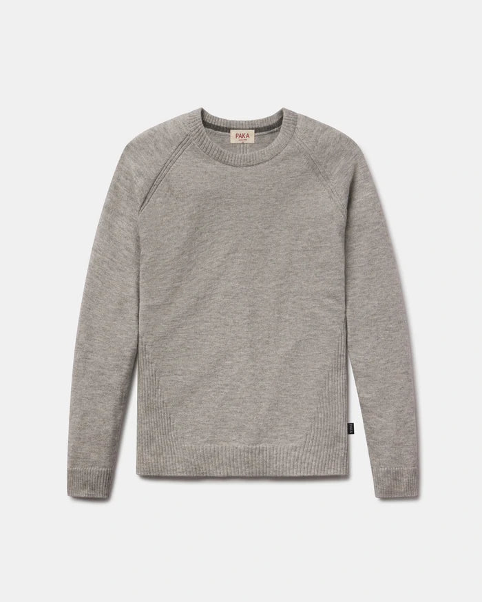 Front view of Women’s Ultralight 1.0 Crew alpaca sweater showing raglan shoulder seams and ribbed cuffs and hem on light gray background