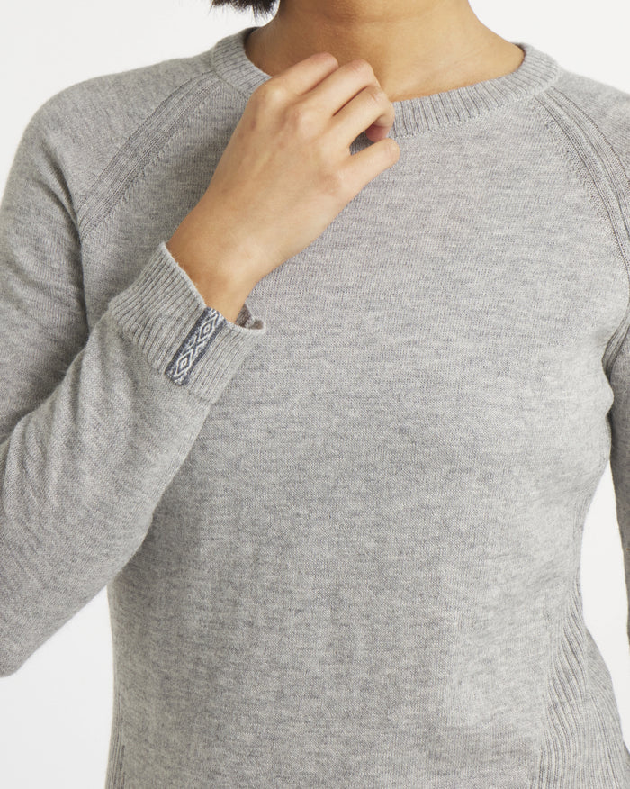 Close-up front of Women’s Ultralight 1.0 Crew showing heather gray knit, crewneck, raglan seams and patterned cuff on white