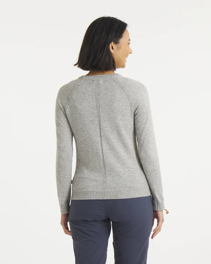 Rear view of Women’s Ultralight 1.0 Crew sweater in heather gray showing center back seam and ribbed hem on model